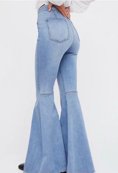 Stretchy Raw Hem Flare Jeans in Light Blue